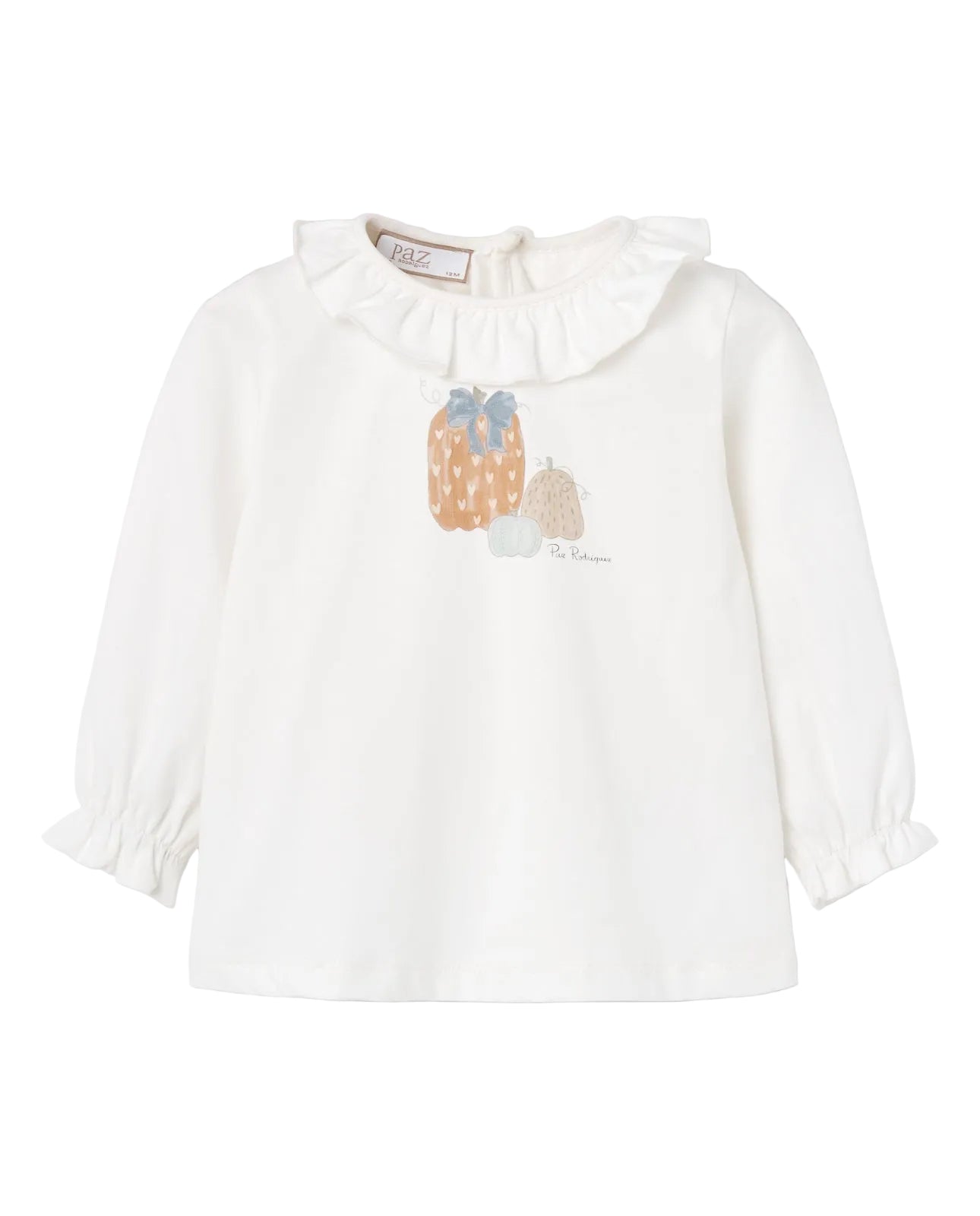 A white long-sleeve blouse for toddlers, featuring a ruffled collar, gathered elbow-length sleeves, and a central graphic of three pumpkins in beige, orange, and light blue. The brand name 'L'Envers' is visible on the inner neck label.