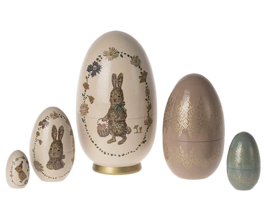 Easter babushka egg set by Maileg showcasing the 5 wooden nesting eggs artfully stacked with charming rabbit designs and colorful patterns.
