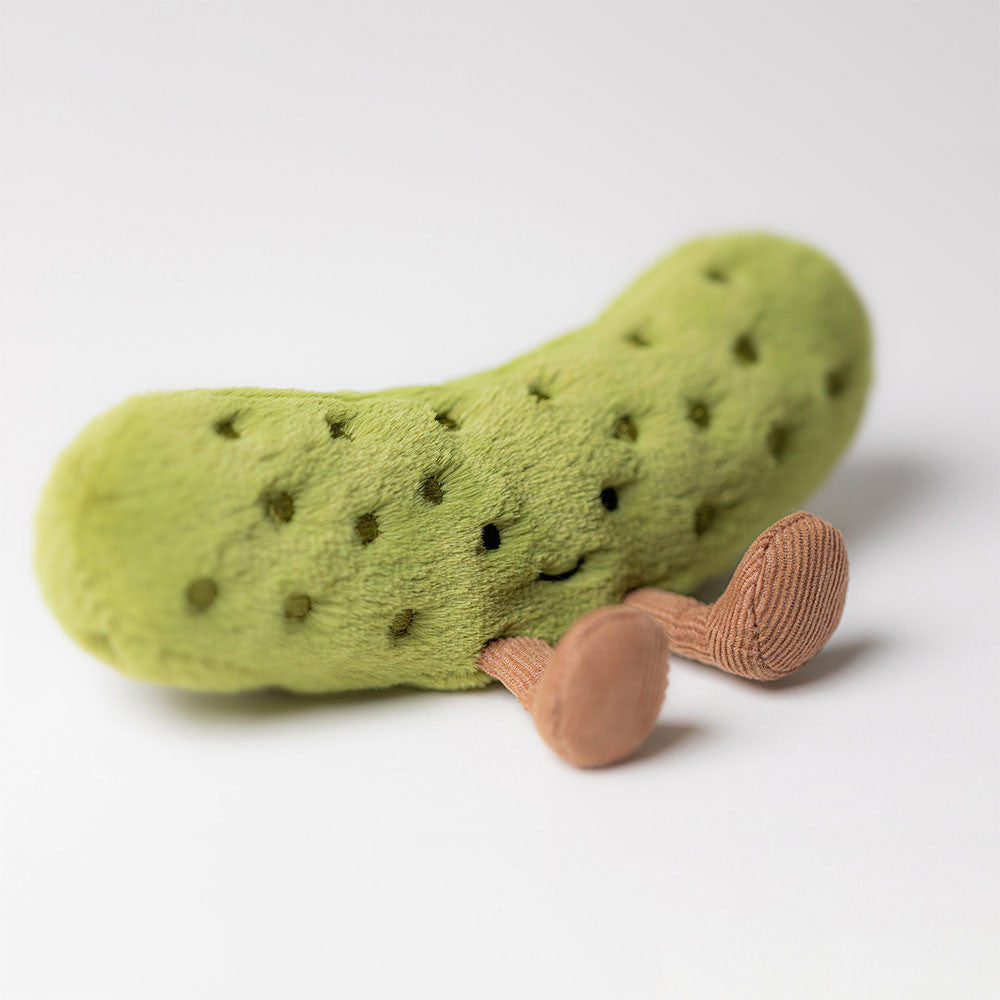 Cute Amuseables Pickle sitting upright, showcasing its embroidered eye and cheerful expression.