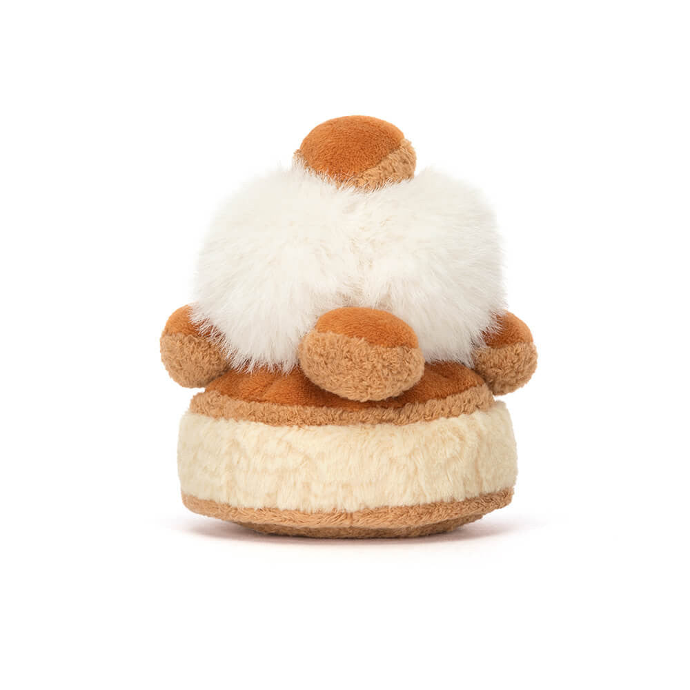 Back view of the cuddly Amuseables Mirielle St. Honoré plush toy from JellyCat, showing its soft texture and round shape.