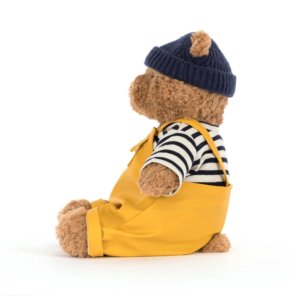 Adventurous Bartholomew Bear Fisherman smiling and posing with fishing gear.