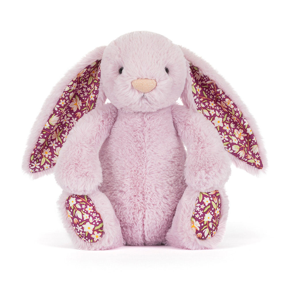 Thistlepop Blossom Luxe Bunny by JellyCat, a soft plush bunny with large floral-patterned ears, sitting upright.