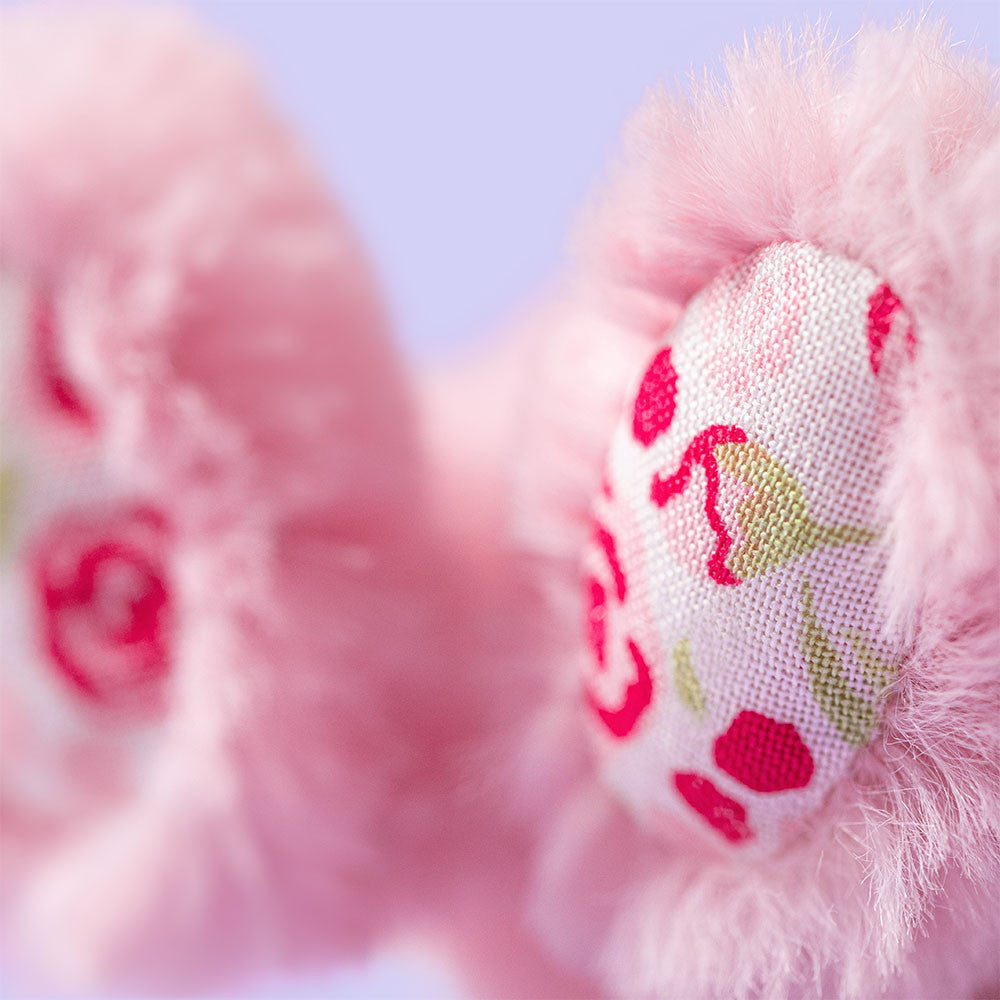 Close-up of the ears of Blushkin Blossom Bunny Bag Charm by JellyCat, highlighting the pretty floral fabric.