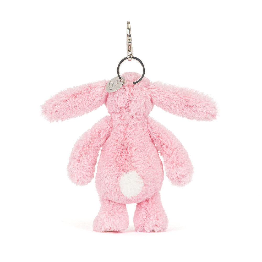 Back view of Blushkin Blossom Bunny Bag Charm by JellyCat, illustrating the soft pink texture and plush tail.