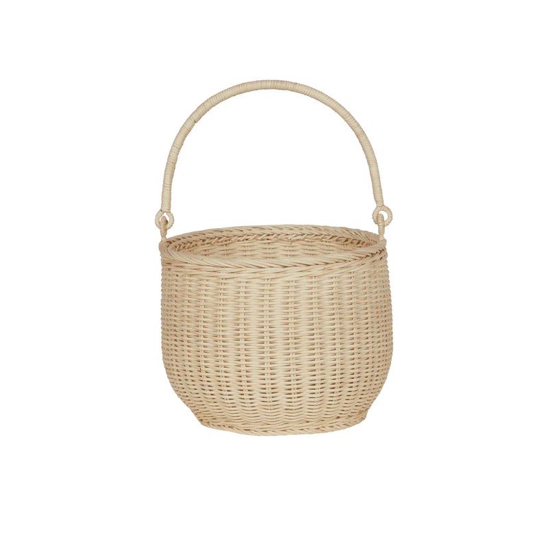 Showcasing the Olli Ella Hand-Woven Rattan Gathering Basket in light beige, designed for collecting treasures during spring outings. This charming basket is ideal for Easter egg hunts and is lightweight for kids to carry.