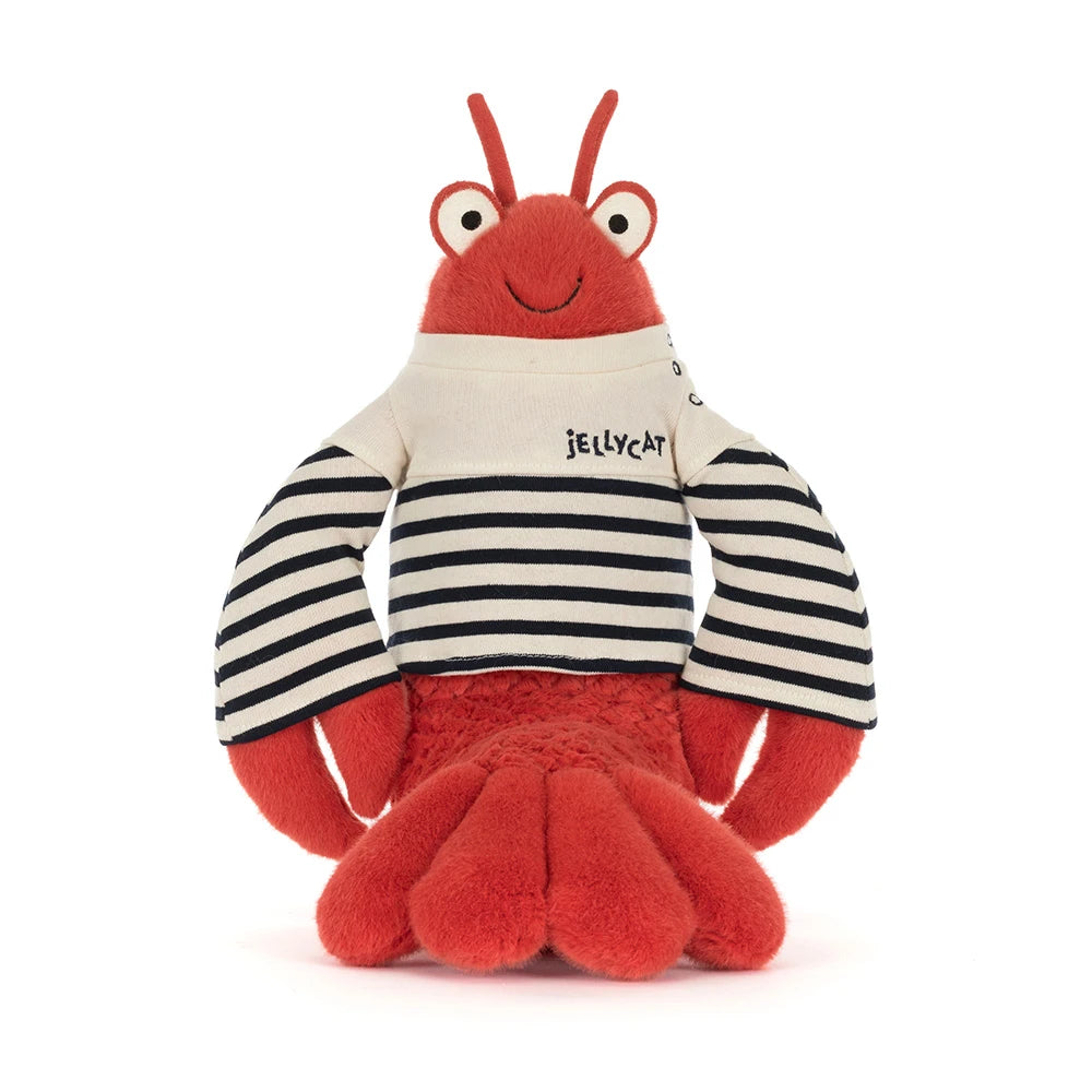 Charming depiction of Larry Lobster Sailor Outfit SS26 against a seaside backdrop, enhancing its playful appeal.