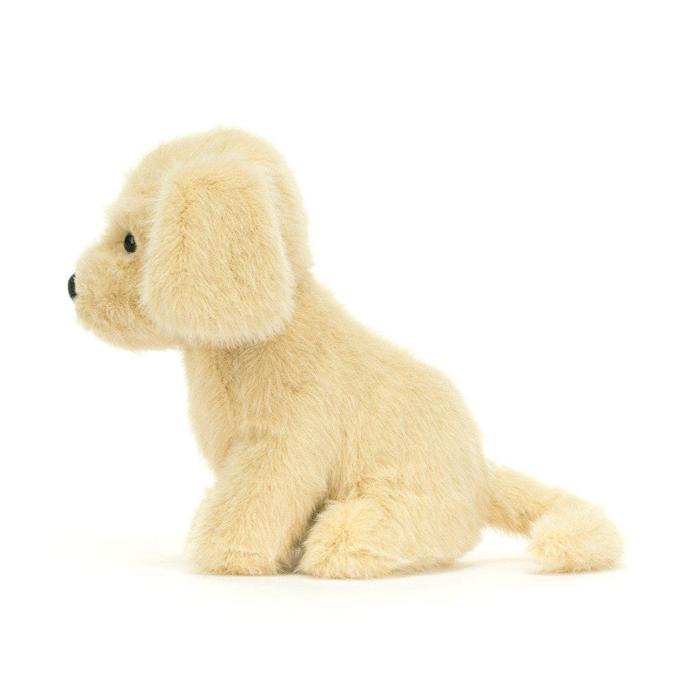 Side view of Golden Puppy plush from JellyCat, highlighting the charming details of its floppy ears and playful stance.