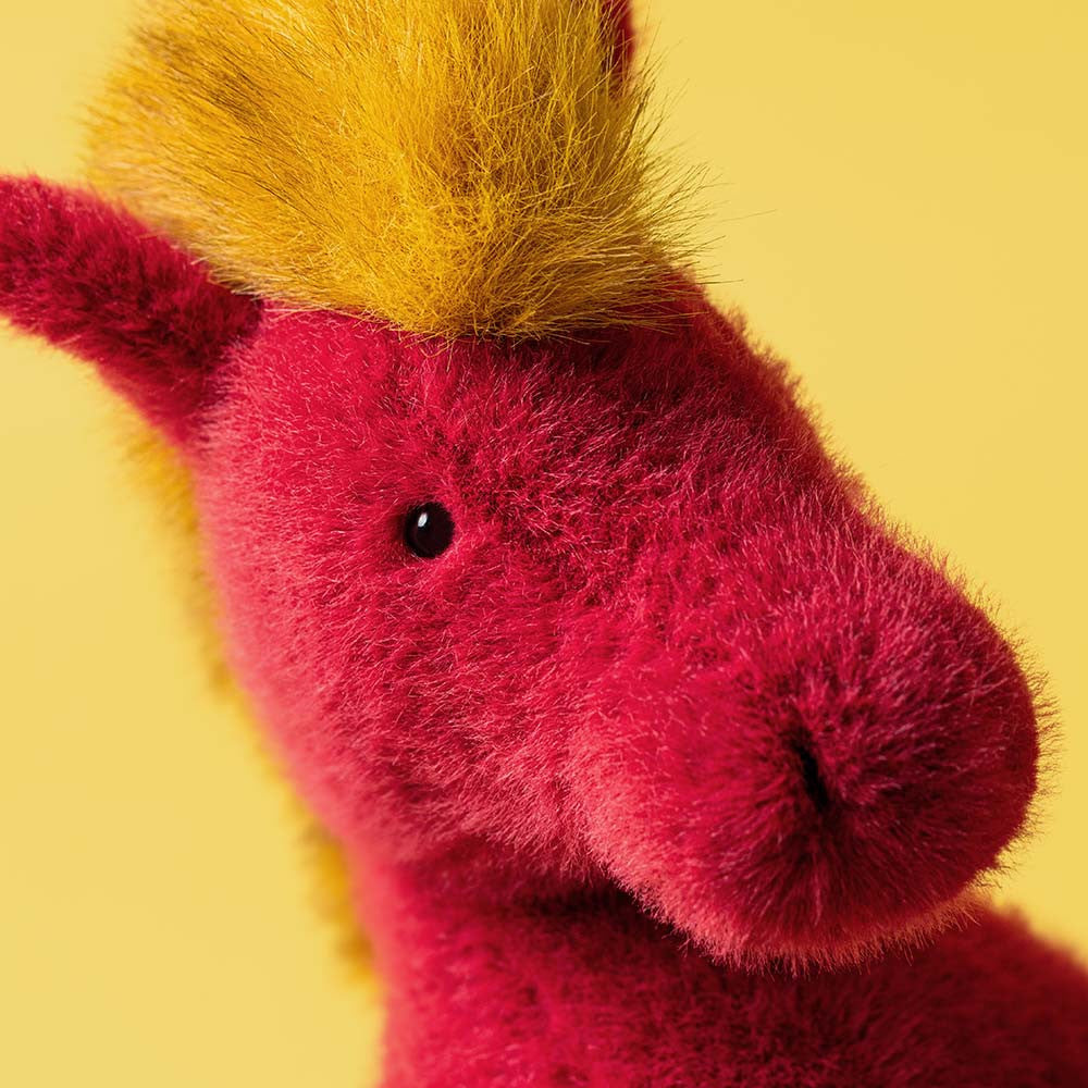 Display of the delightful Festival Horse by JellyCat, showcasing its festive design and soft touch.