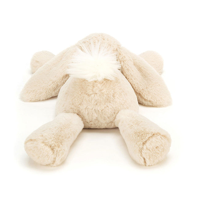 Back view of the Smudge Rabbit plush toy by JellyCat, showcasing its soft body and fluffy hairstyle.