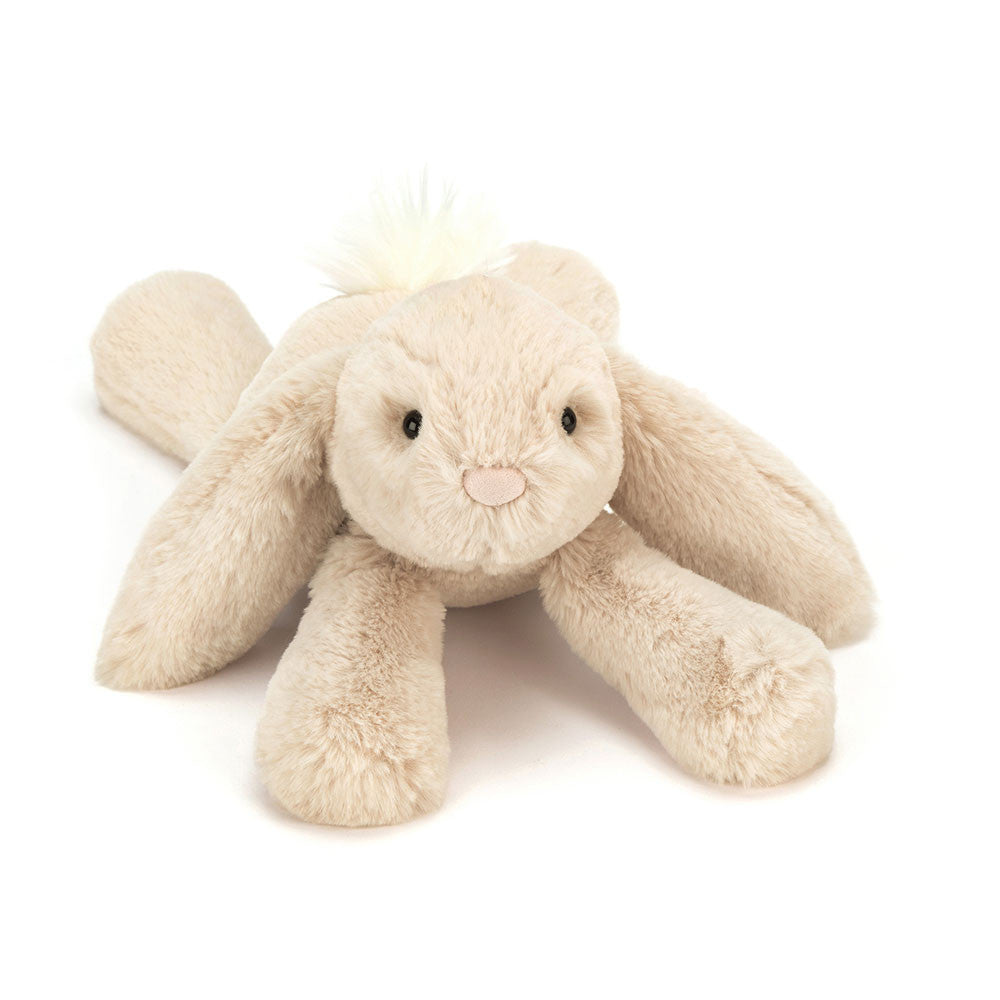 Cute Smudge Rabbit plush toy by JellyCat, featuring long floppy ears and a soft, fluffy body in light tan color.