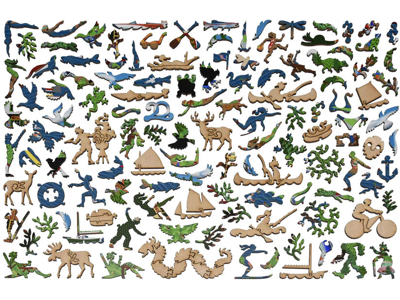 An assortment of uniquely shaped puzzle pieces featuring various lake-themed designs, from the 'Summer at the Lake' puzzle by Liberty Puzzles.