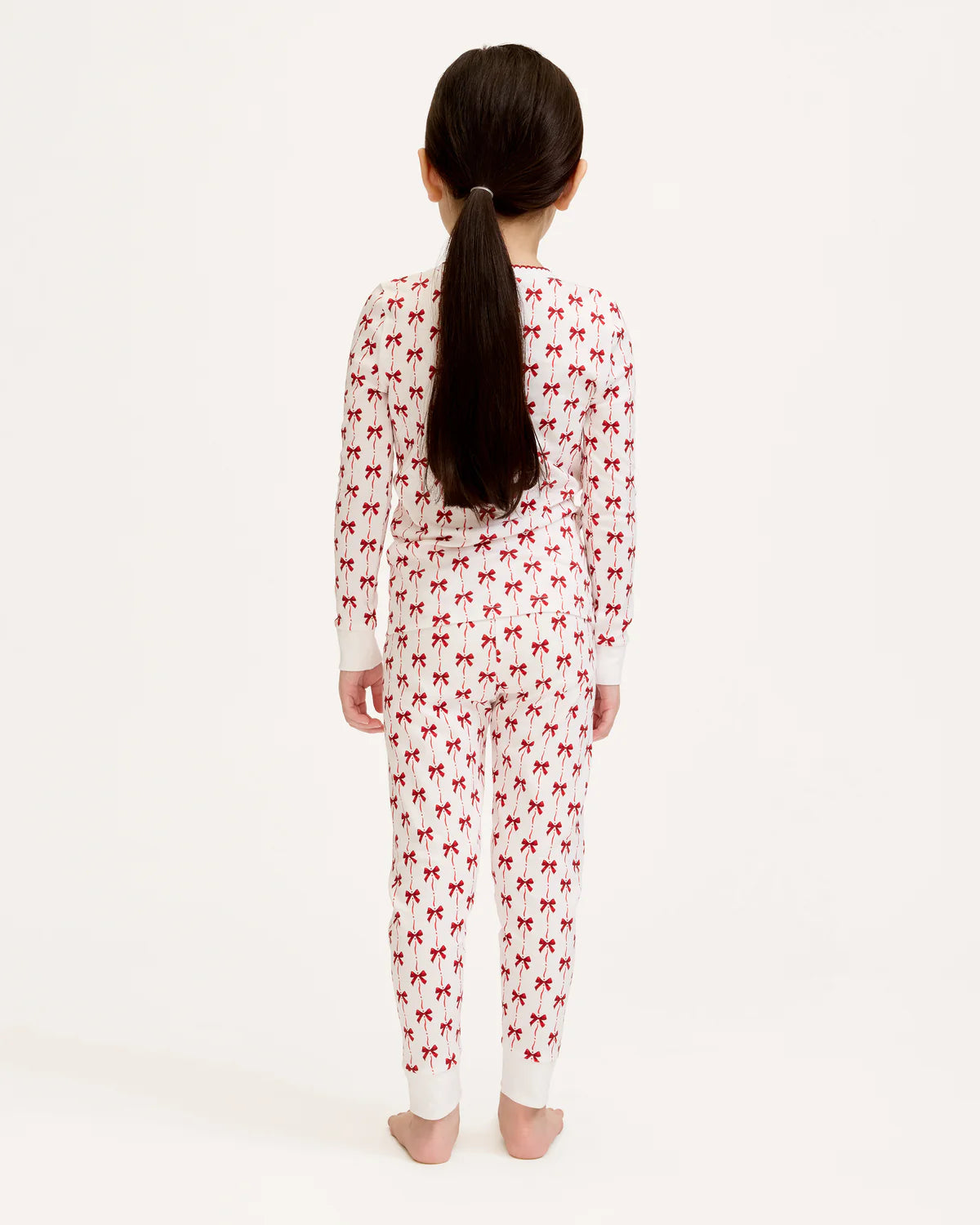 Girls Pima Snug Fit Pajama in Blissful Bows showcased with family pajamas, illustrating coordinated holiday sleepwear.