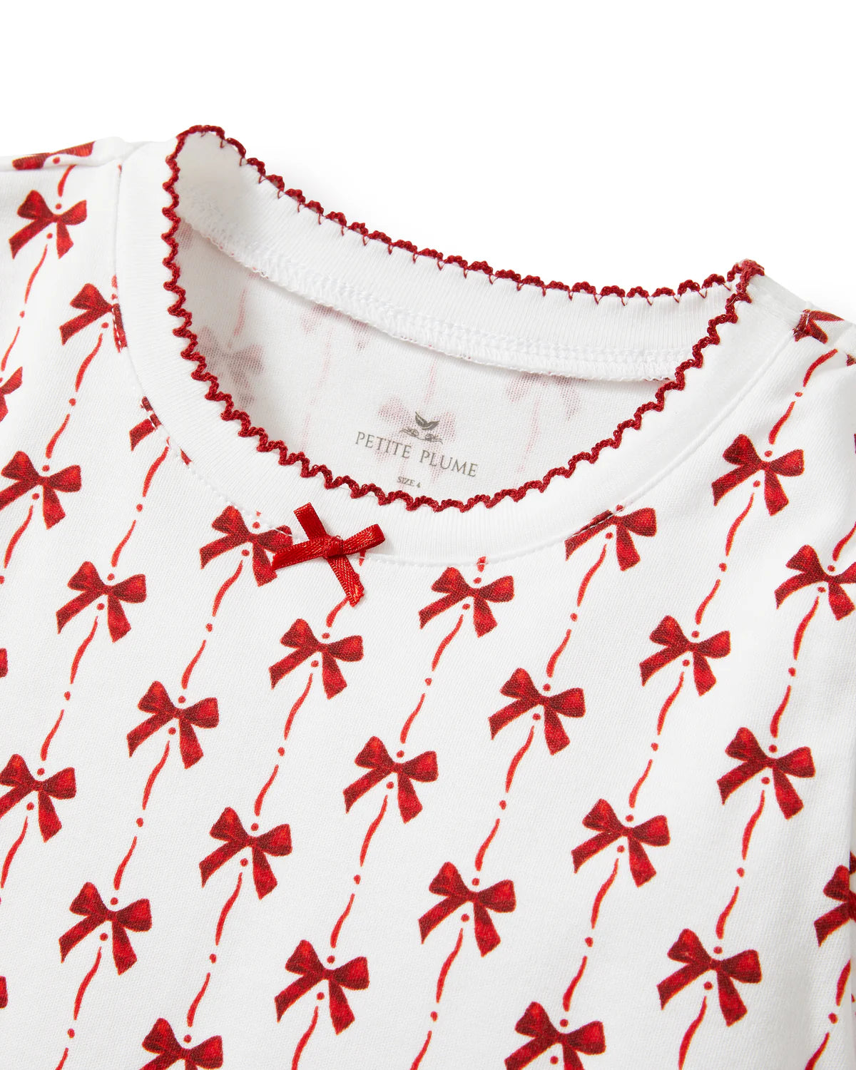 Stylish flat lay of Girls Pima Snug Fit Pajama in Blissful Bows along with accessories for a cozy bedtime look.