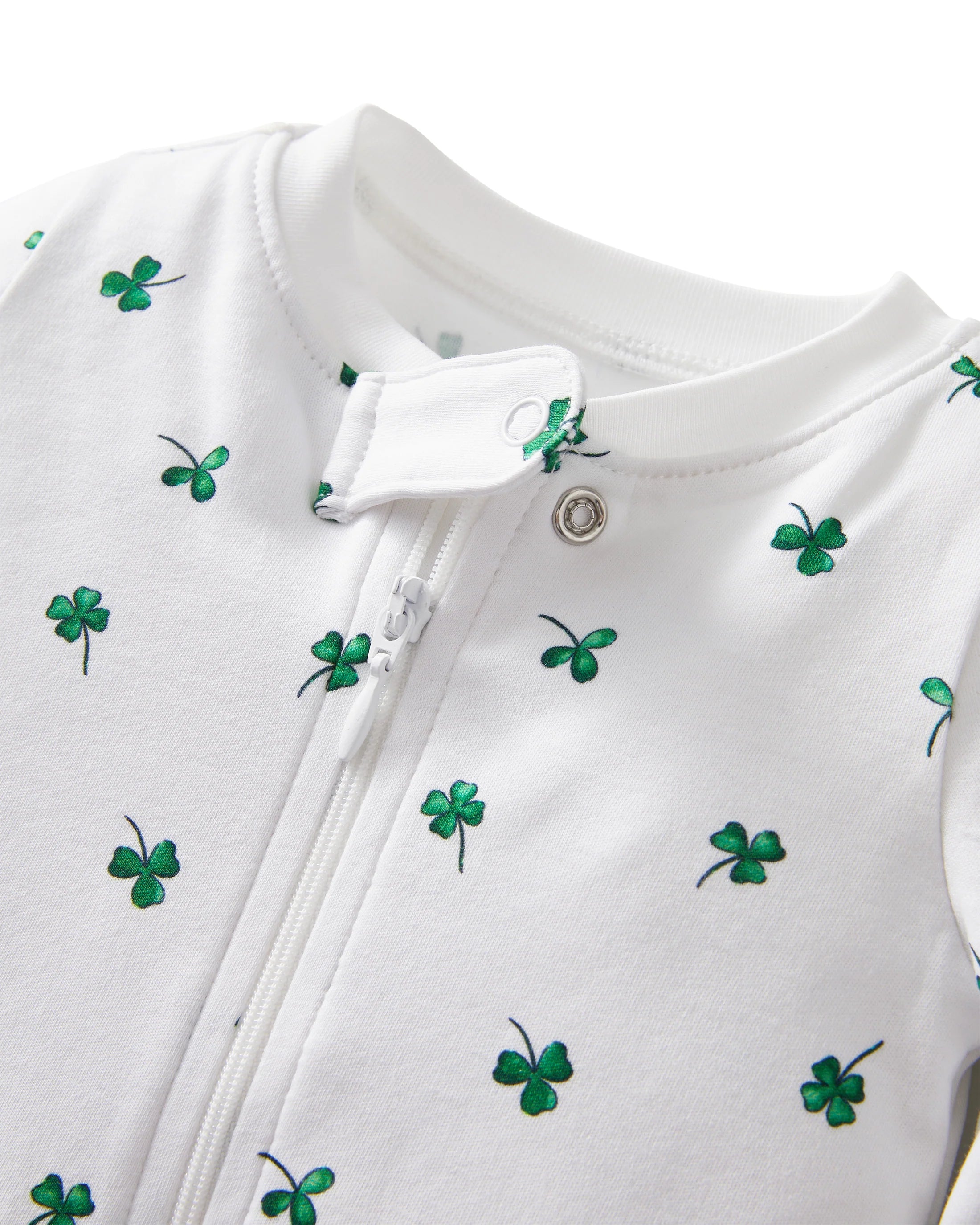 Close-up of Baby's Pima Romper in Shamrocks by Petite Plume, highlighting the green shamrocks and the zipper detail, perfect for cozy daywear.