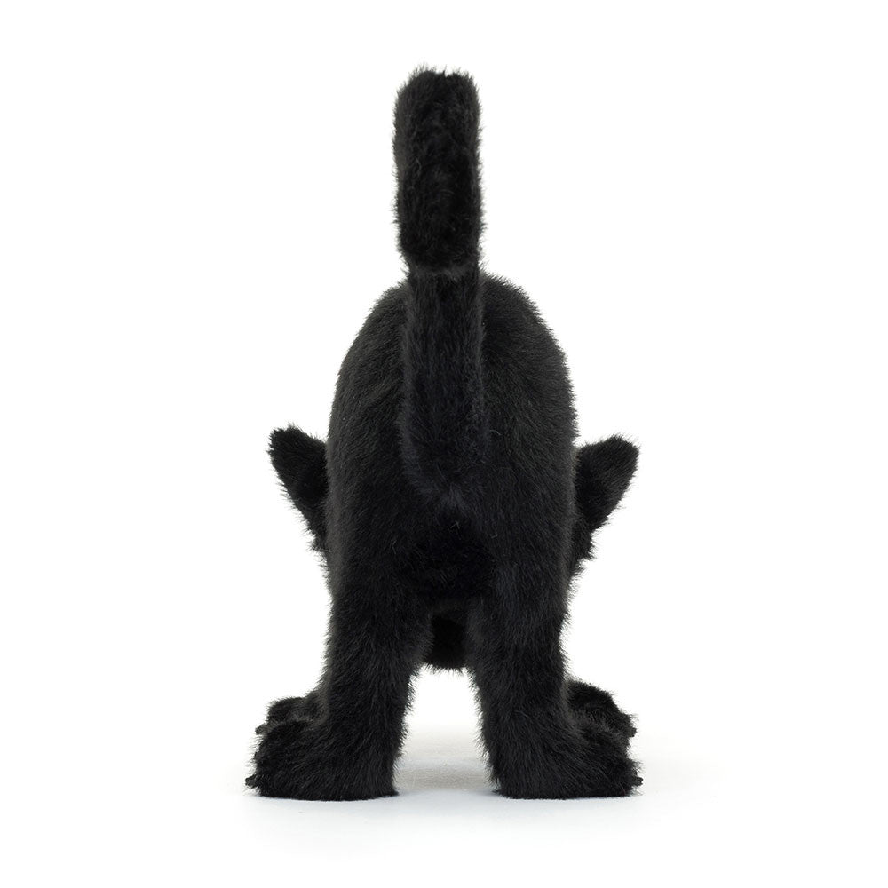 Close-up of Spookipaws Cat from JellyCat, showing the embroidered eyes and textured fur of this lucky charm plush.
