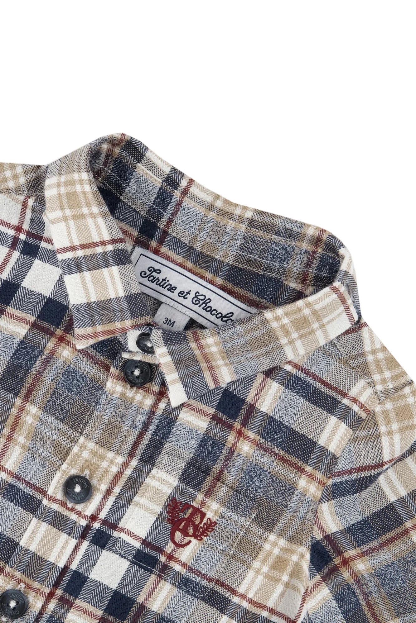 Plaid shirt with collar and brand label on a white background