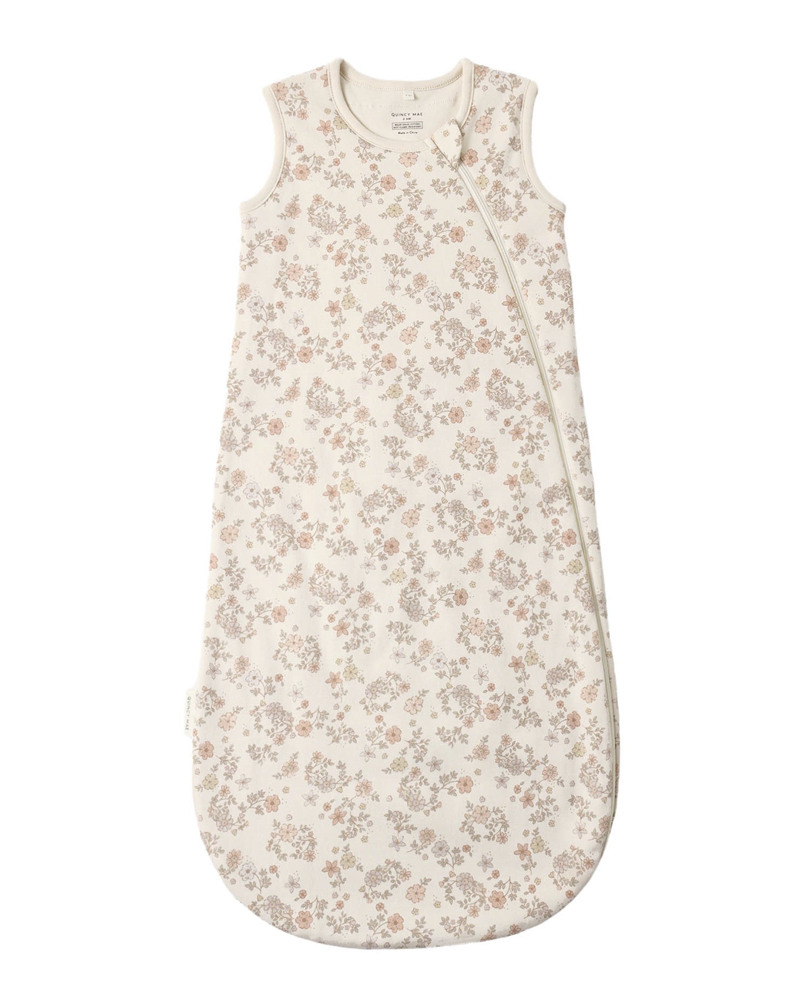 Baby sleeping bag with floral pattern on a white background