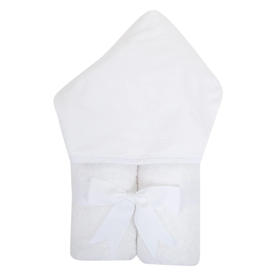 3 Marthas Children's Hooded Towels featuring a white seersucker stripe design, perfect for kids up to 8 years. This towel showcases a terry lined hood and is elegantly rolled with a grosgrain ribbon, making it an ideal gift for bath or beach time.