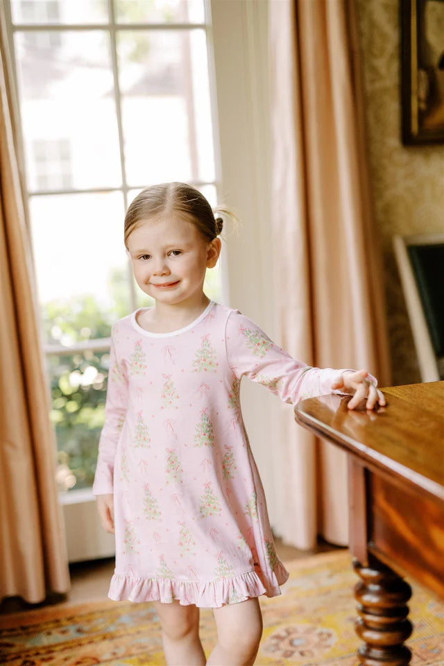 Pink Tinsel Play Dress from The Proper Peony featuring a charming pink tinsel print, perfect for holiday gatherings.