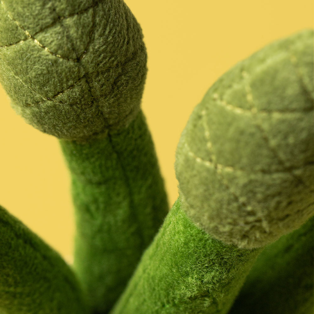 Amuseables Asparagus by JellyCat, a cozy plush filled with polyester fibers, perfect for kids and adults alike.