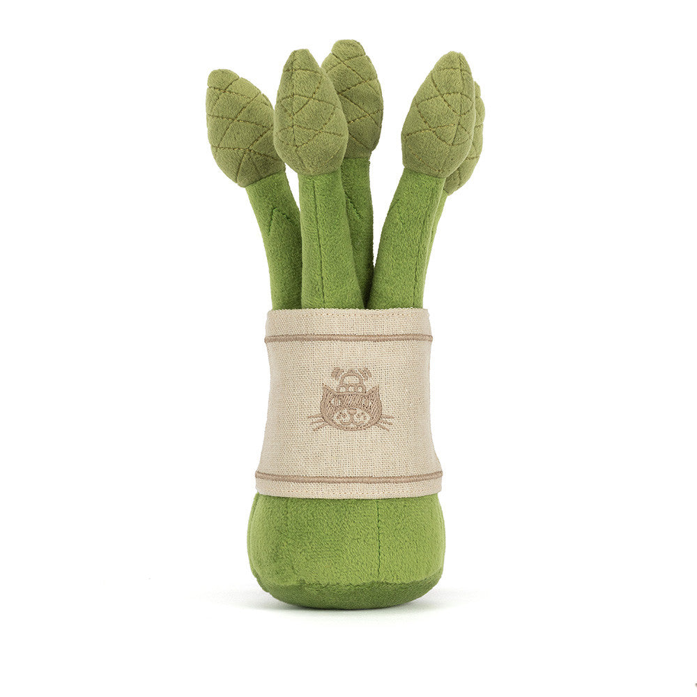 Amuseables Asparagus plush standing on a shelf, adding personality to home decor with its cute and quirky look.