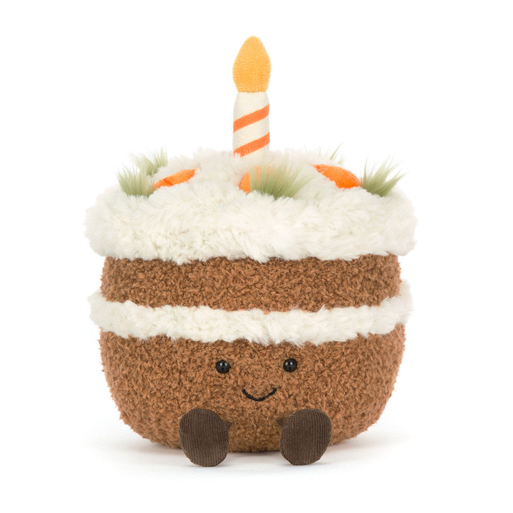 Close-up of Amusables Carrot Cake by JellyCat displaying its adorable plush texture, topped with a candle and vibrant carrot decorations.