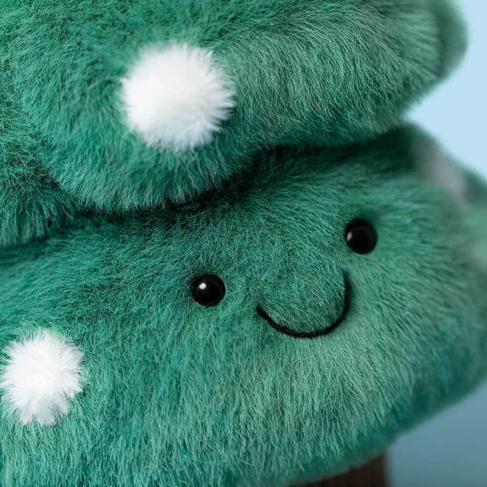 Amuseables Christmas Tree surrounded by children, highlighting its appeal as a fun and cuddly holiday gift.