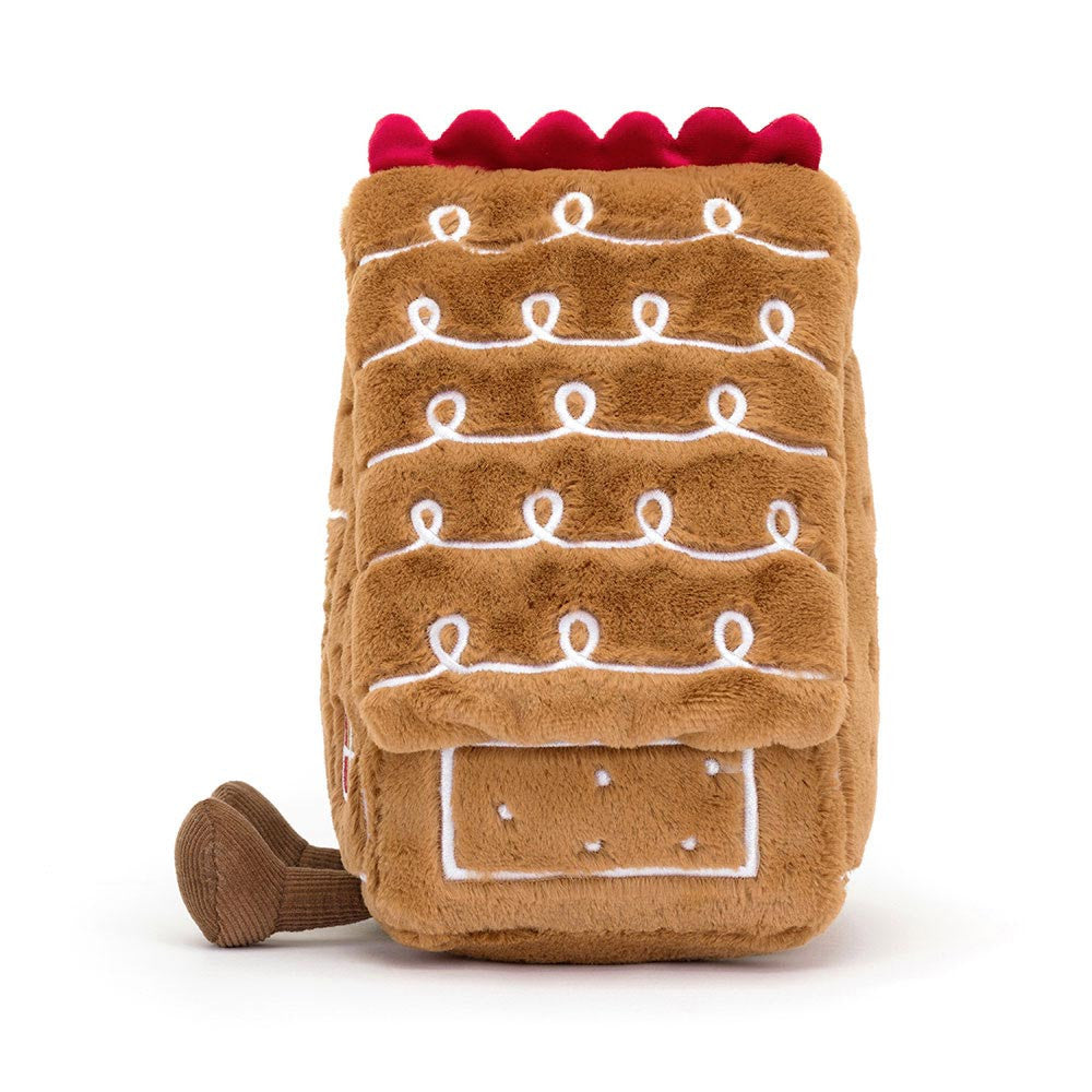Close-up of the Amusable Gingerbread House by JellyCat, showcasing its charming details and cozy design as an adorable holiday decoration.