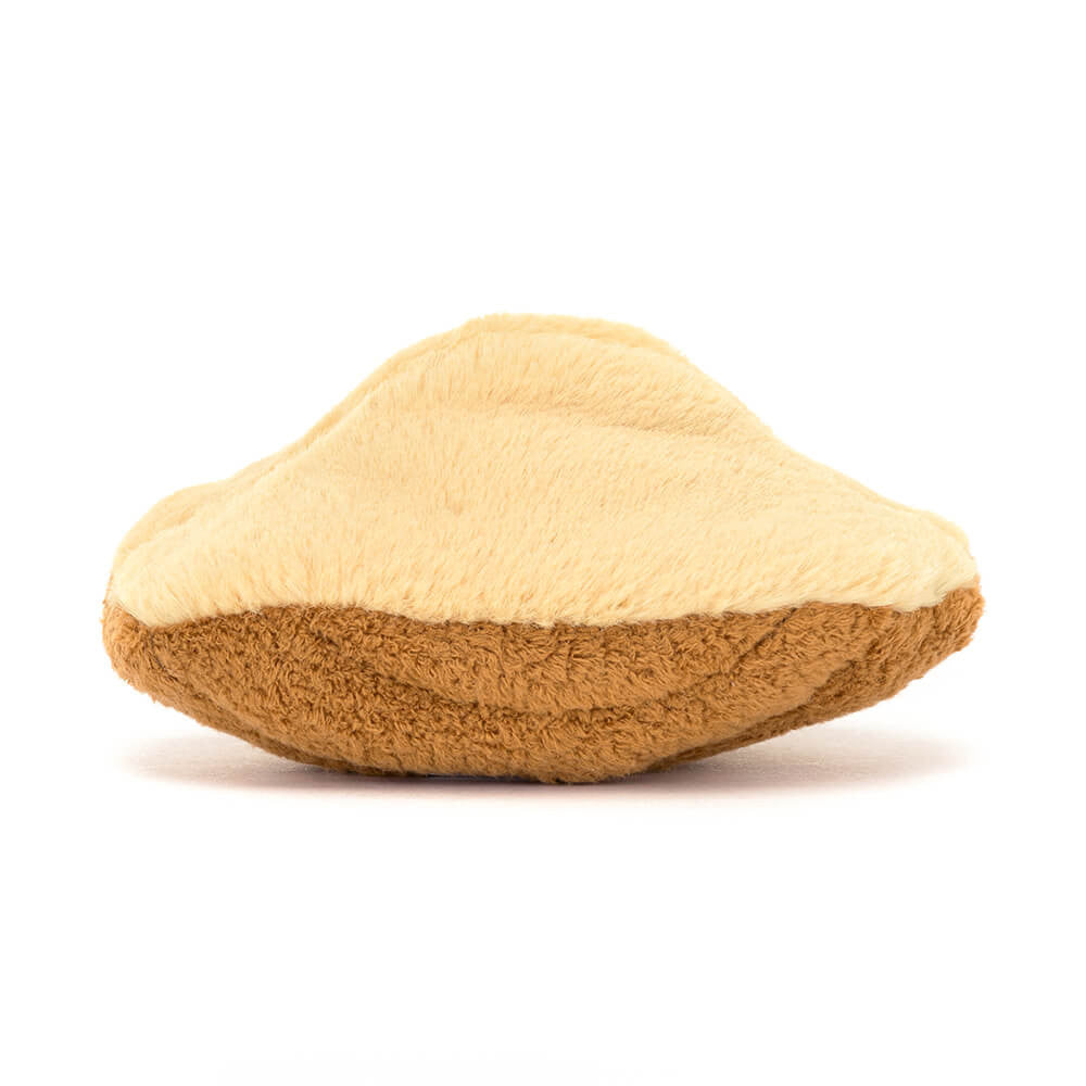 Side profile of the Amuseables Margaux Madeleine plush toy by JellyCat, displaying its unique shape and soft fabric.