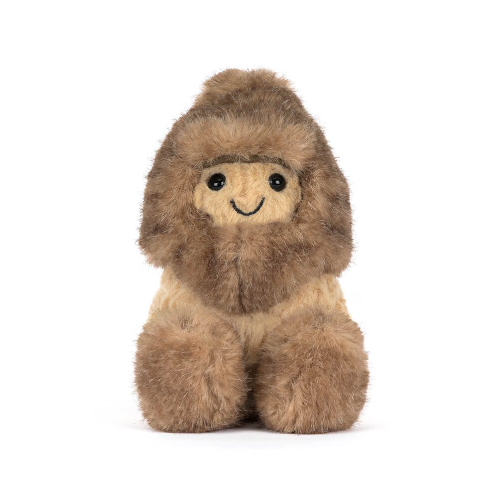 Side view of Amuseables Peanut Yeti Outfit highlighting its compact size and soft textures.