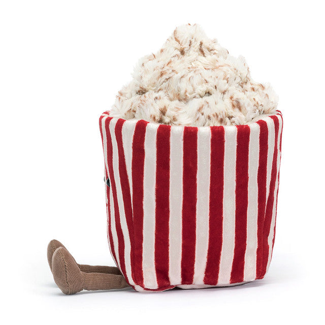 Side view of the JellyCat Amuseables Popcorn character plush toy, featuring a soft, fluffy popcorn top and a playful design.