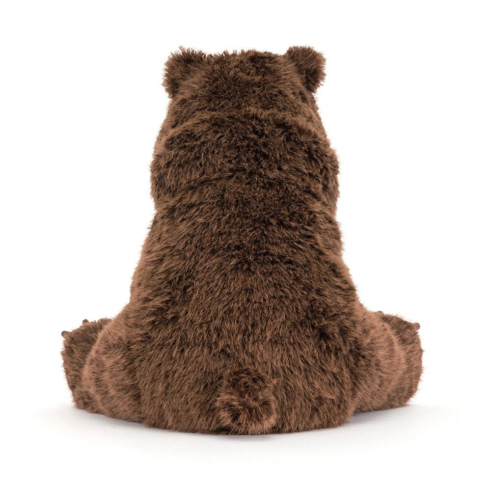 Bizzlestomp Bear by JellyCat displayed as a large cozy plush toy for collectors
