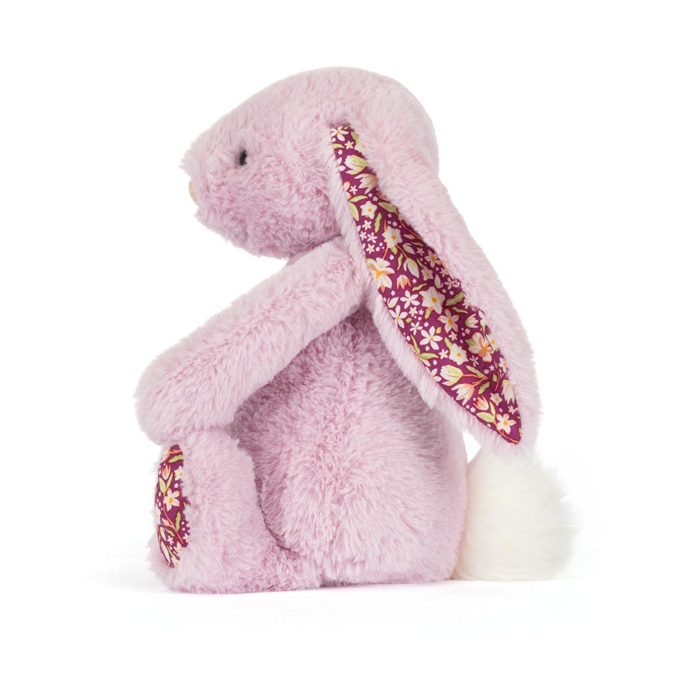 Side profile of Thistlepop Blossom Luxe Bunny by JellyCat, displaying its adorable features and plush texture.
