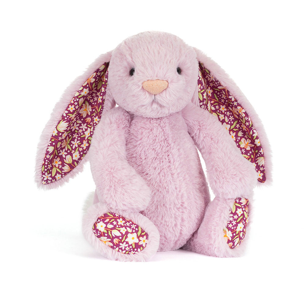 Thistlepop Blossom Luxe Bunny by JellyCat, sitting with a charming pose and vibrant floral ears.