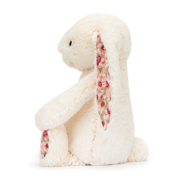 Blossom Cream Bunny Berry Little, a snuggly plush bunny with a playful expression, great for imaginative play and comfort for all ages.