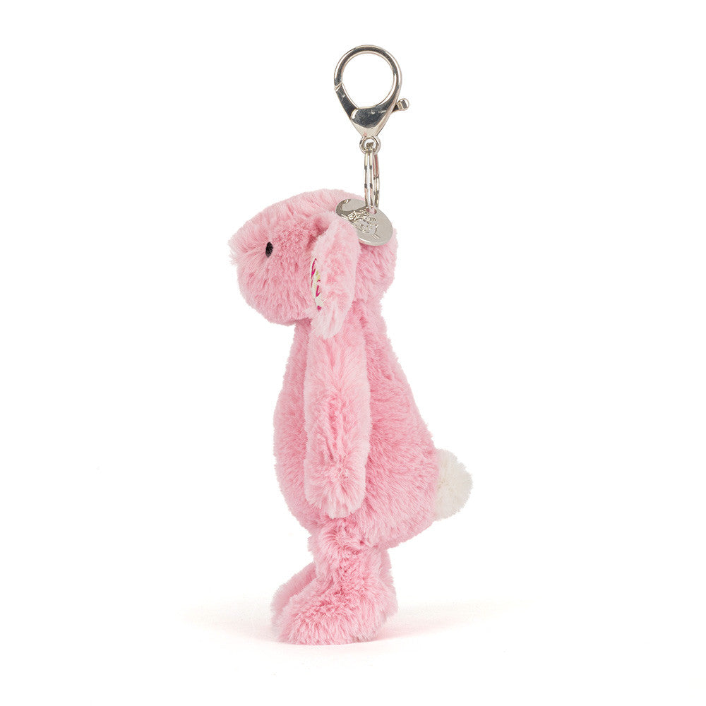 Side profile of Blushkin Blossom Bunny Bag Charm by JellyCat, displaying the bunny's charming features and keychain clip.