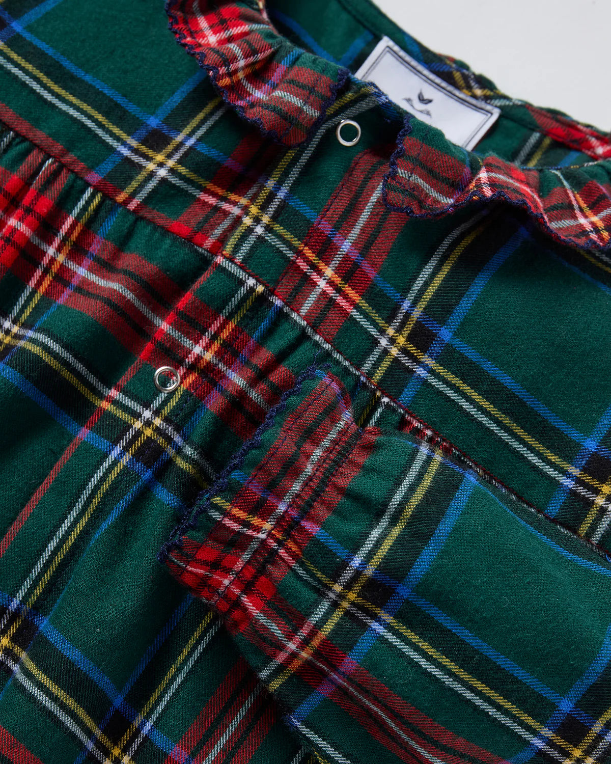 Close-up of Baby Twill Madeline Romper Kensington Plaid fabric, highlighting the soft brushed cotton and classic plaid pattern.