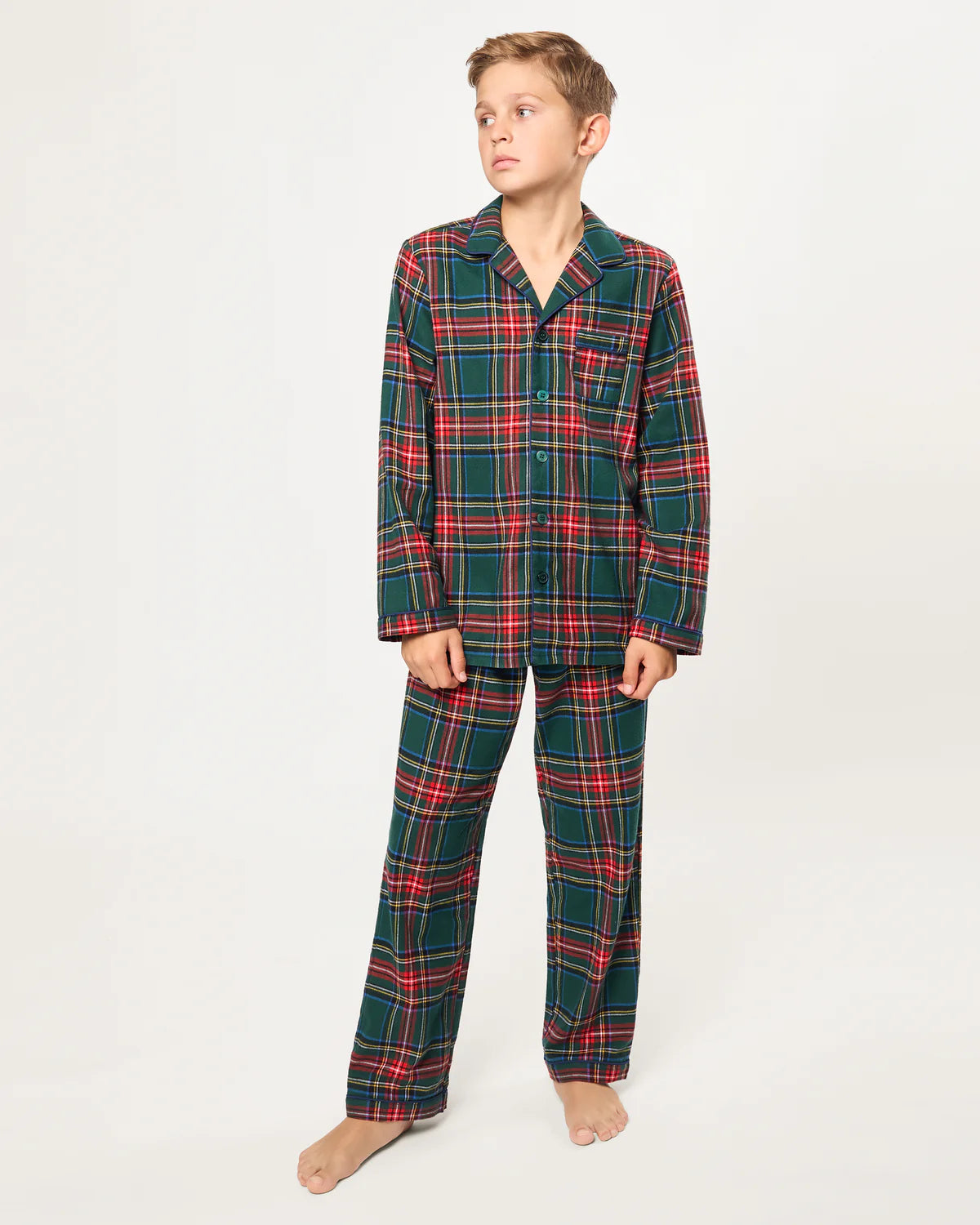 Family gathered around the fireplace wearing matching Children's Brushed Twill Pajama Kensington Tartan.
