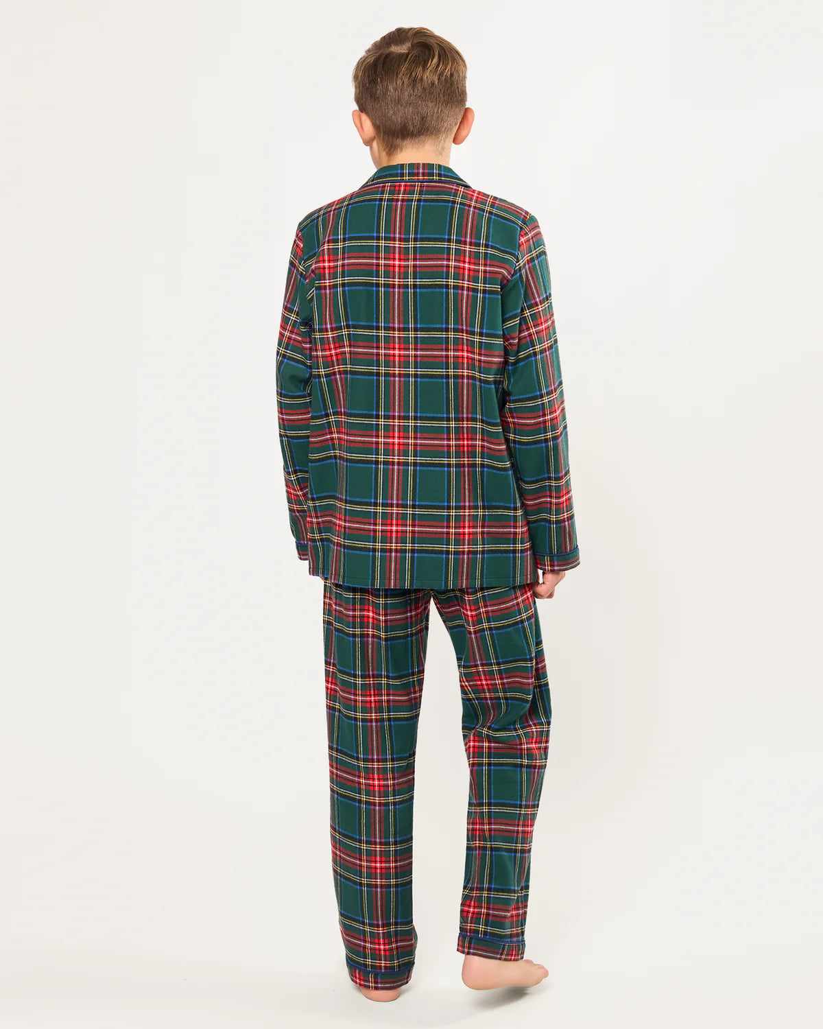 Child snuggled up in a cozy blanket wearing Children's Brushed Twill Pajama Kensington Tartan.
