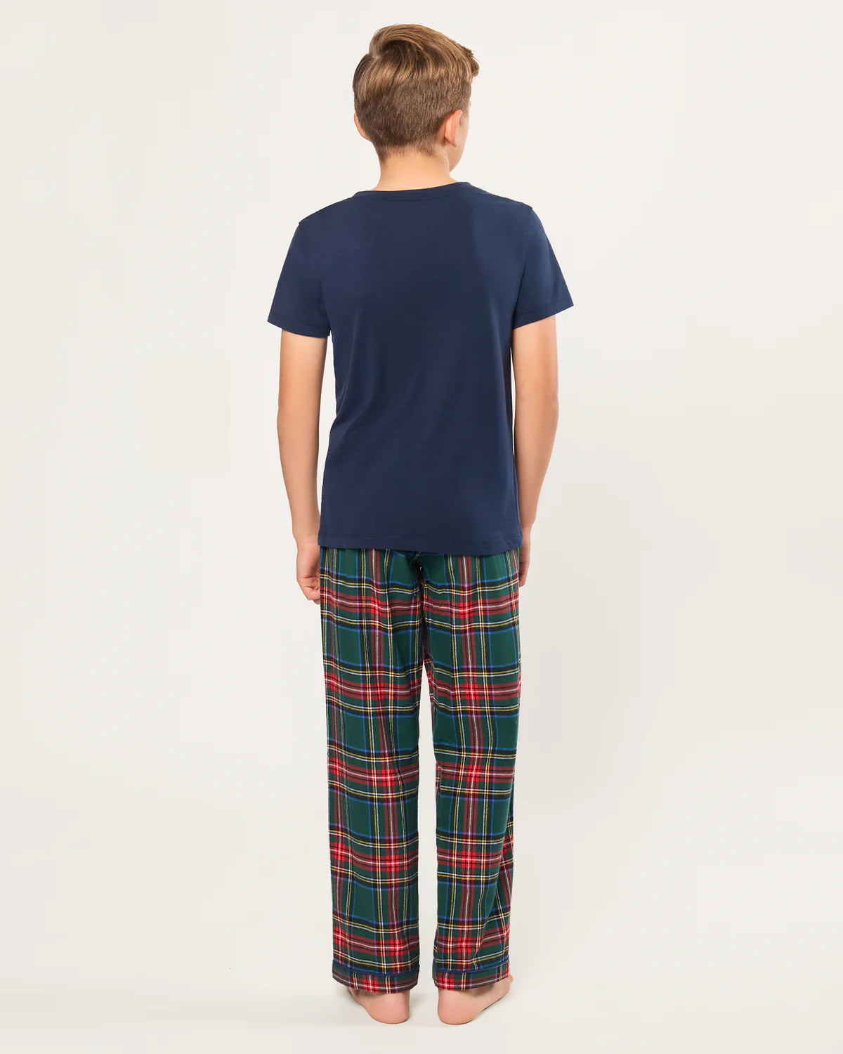 Child wearing the Children's Brushed Twill Pant in Kensington Tartan, enjoying a cozy winter evening.