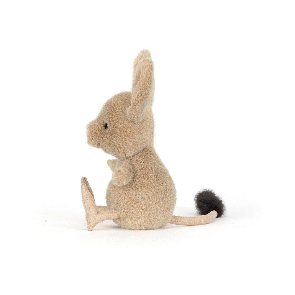 Side view of the JellyCat Jerboa toy, highlighting its fluffy texture and playful tail, ideal for kids.