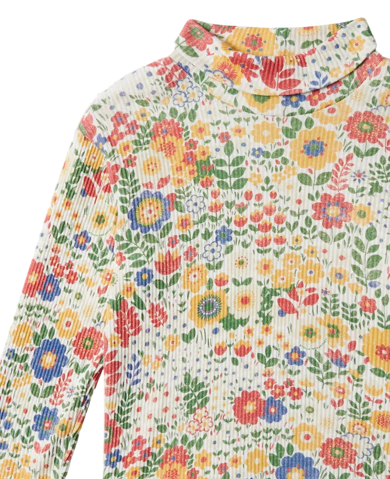A close-up of a long-sleeve mock neck top featuring a vibrant, multicolor floral print on a textured corduroy fabric.