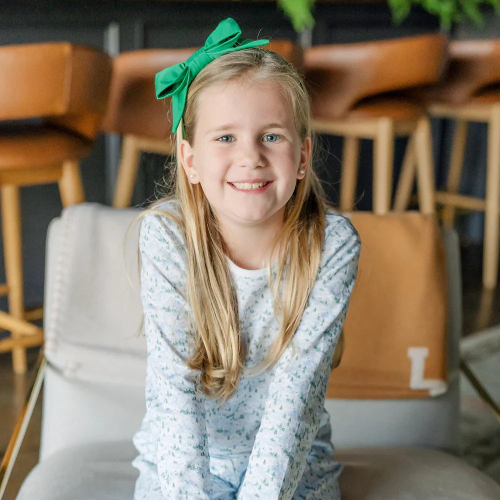 Lifestyle shot of a child wearing the Millie Girls' Pant Set - Snow-Capped Mountains enjoying outdoor play.