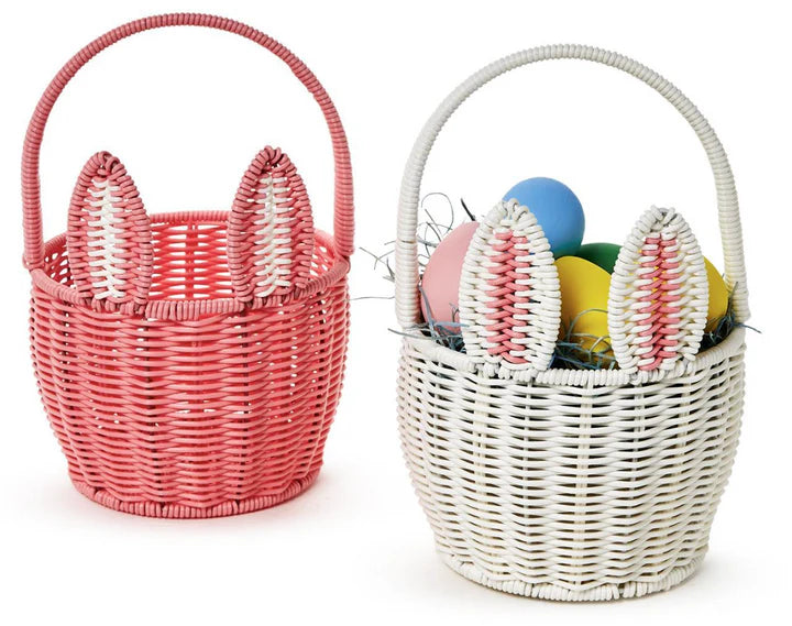 Pink and white faux wicker bunny baskets showcasing colorful Easter eggs, ideal for festive celebrations, from Cupcakes and Cartwheels.