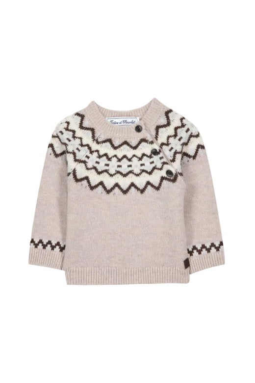 Beige sweater with black pattern on a white background