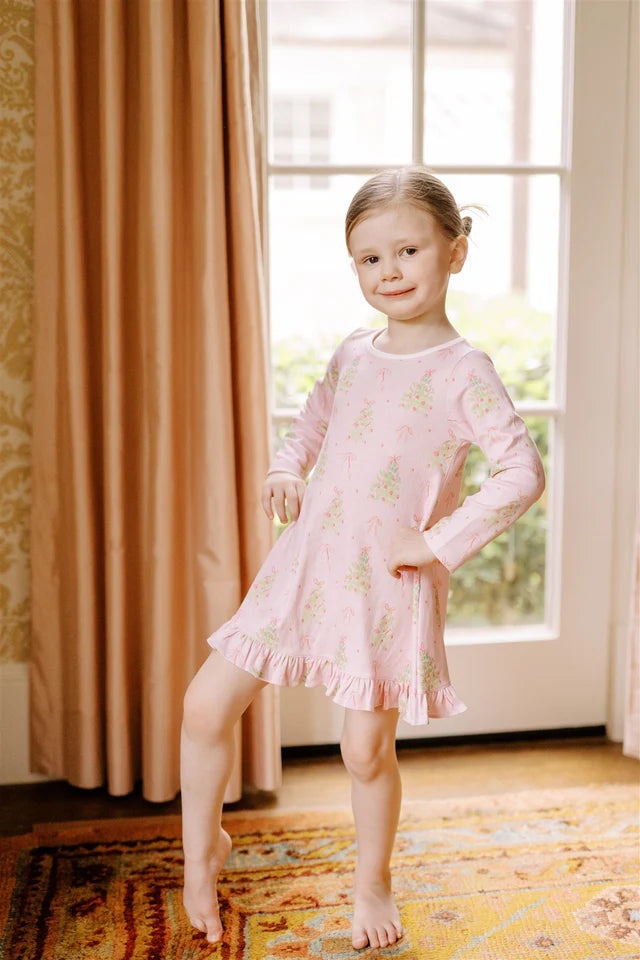 The Proper Peony Pink Tinsel Play Dress styled for festive occasions, showcasing elegance and playful design.